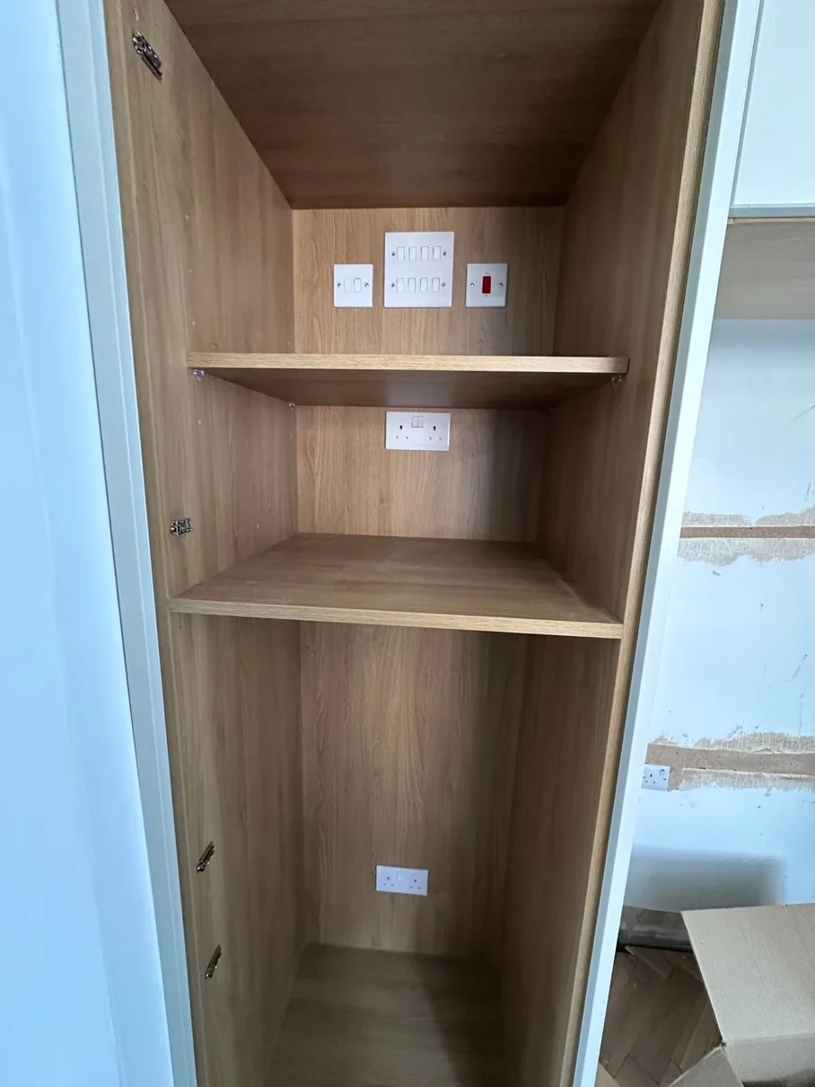 Kitchen utility cupboard — fused spurs and socket bank
