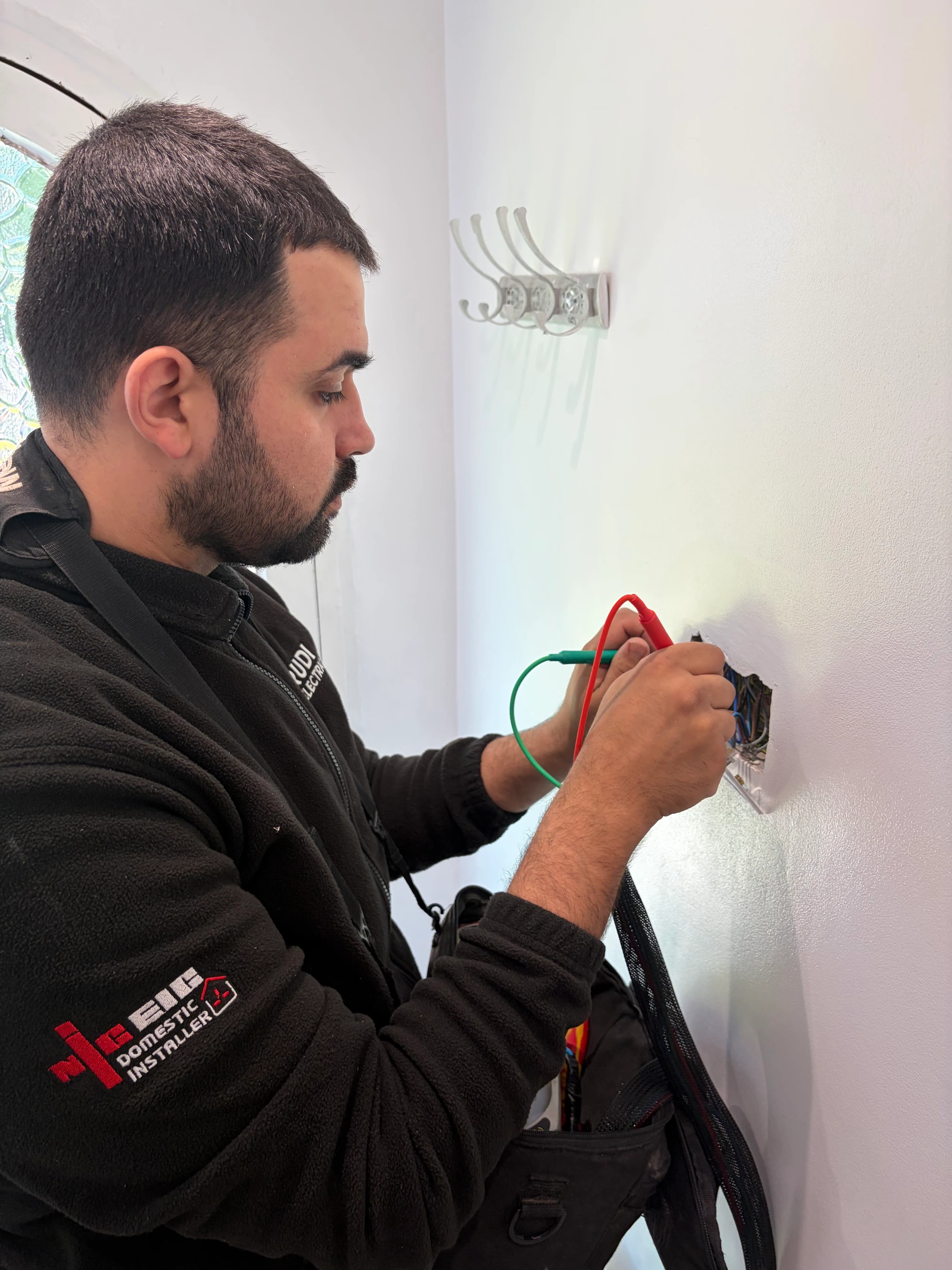 Rudi testing the fixed electrical installation at an accessible wiring point