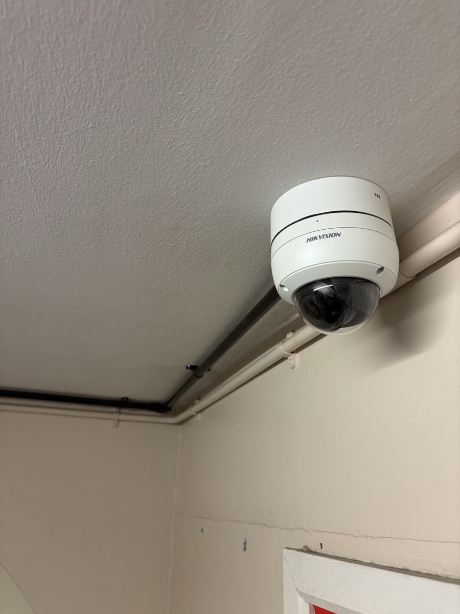 Hikvision dome CCTV camera mounted at ceiling level in Enfield