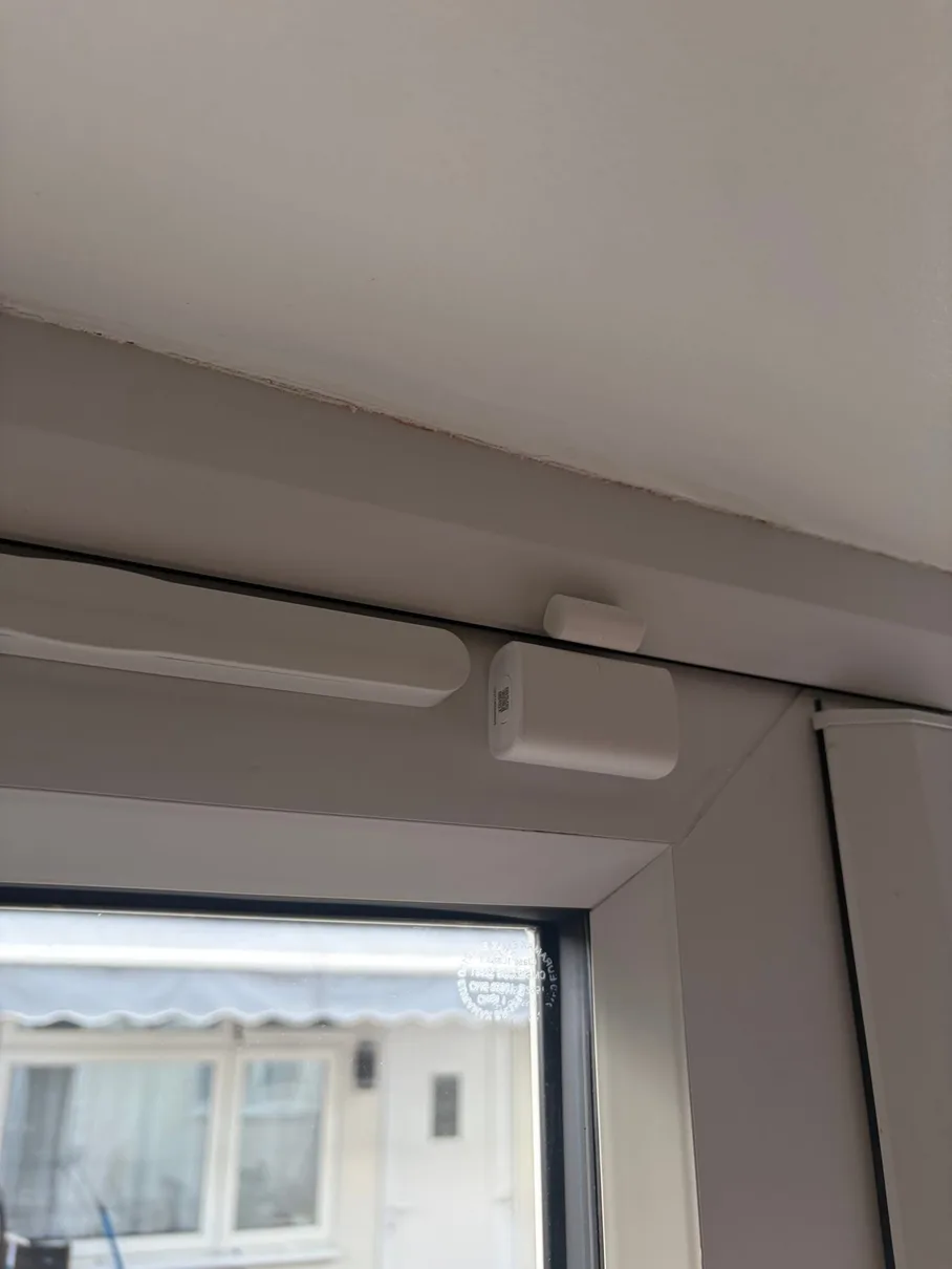 Aqara door sensor on front door — phone alert when opened