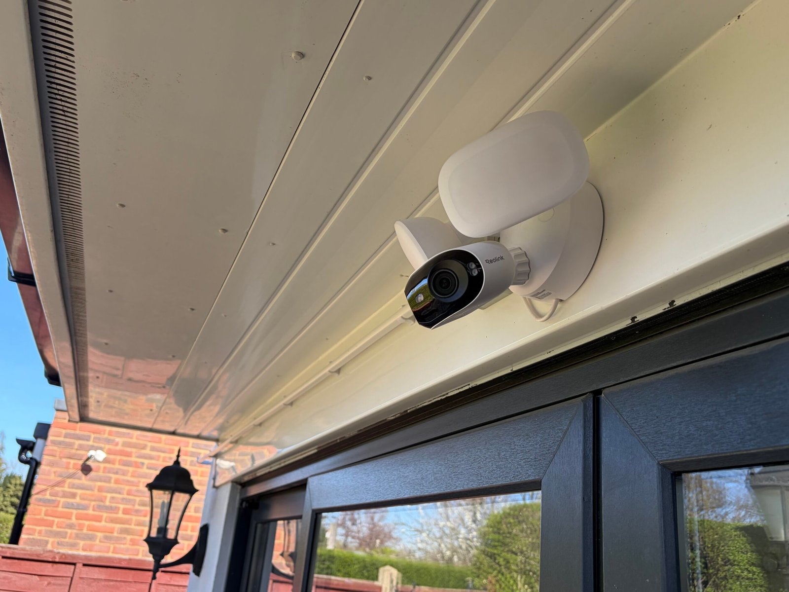 Reolink floodlight CCTV camera installed on soffit — North London