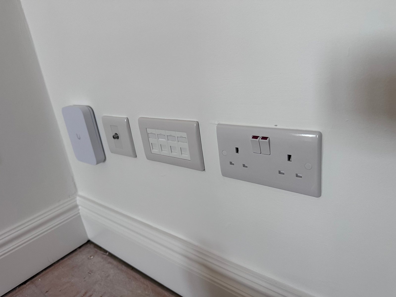 Ubiquiti access point, CAT6 data points and double socket — home network North London
