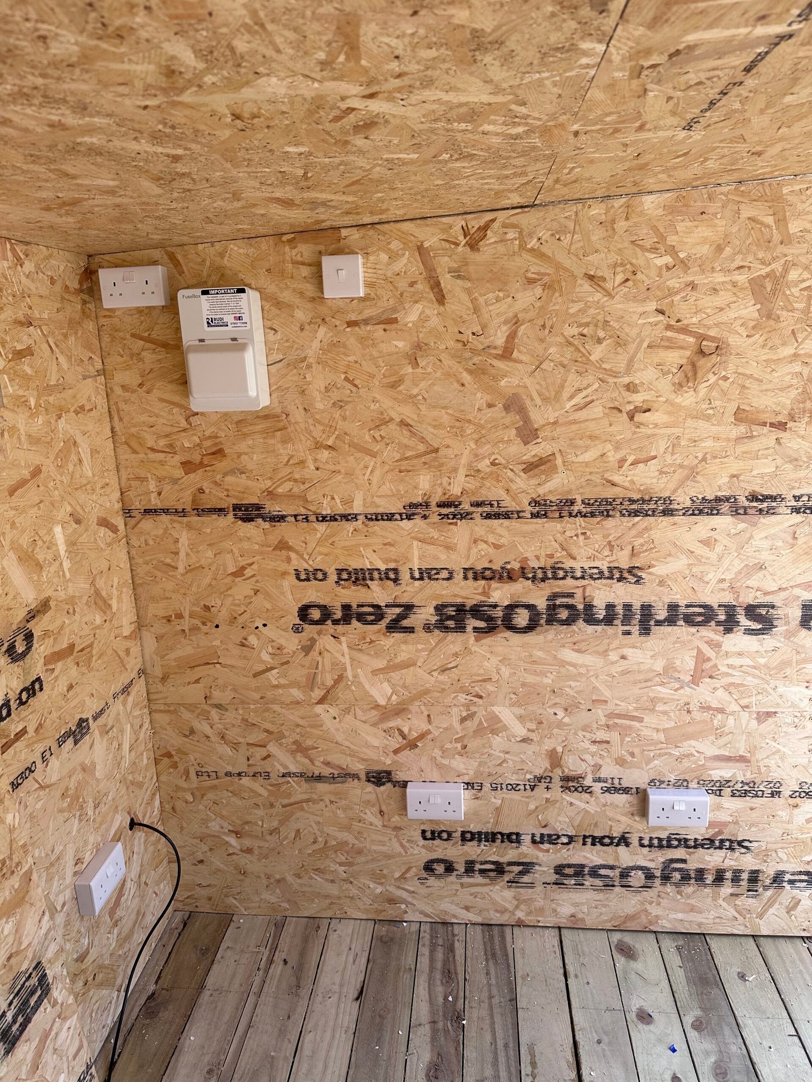 Reolink bullet CCTV camera on wall corner — North London