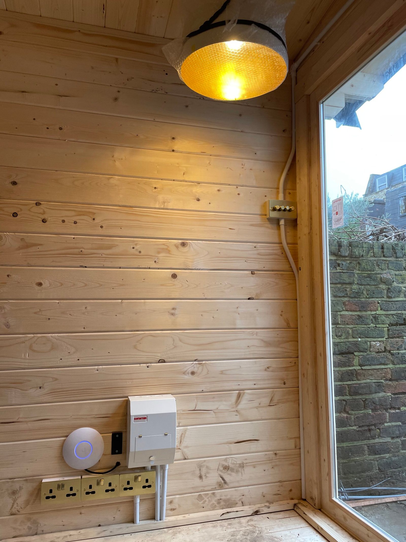 Reolink video doorbell installed on door frame — North London