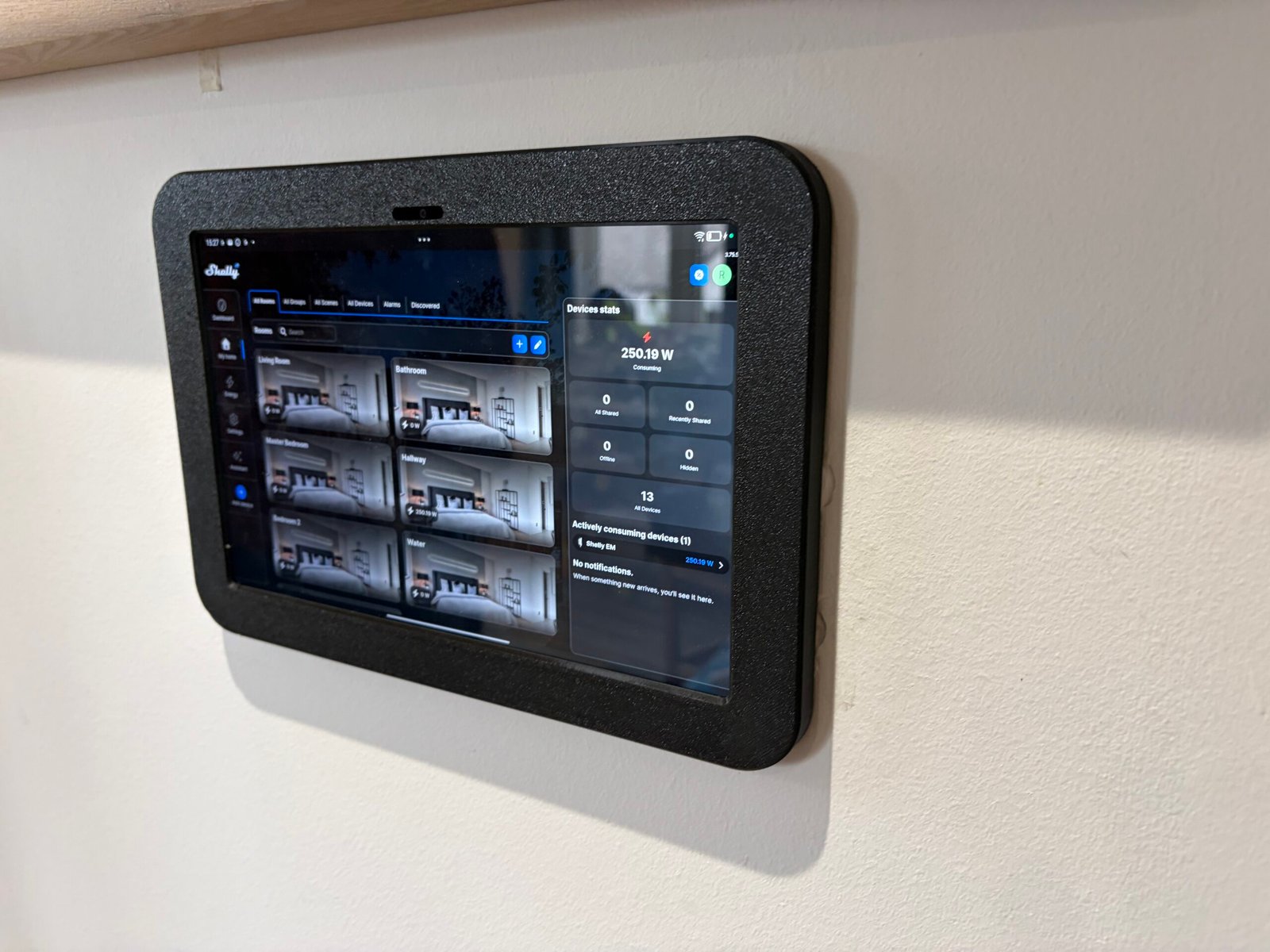 Shelly smart home wall tablet showing room controls and energy monitoring