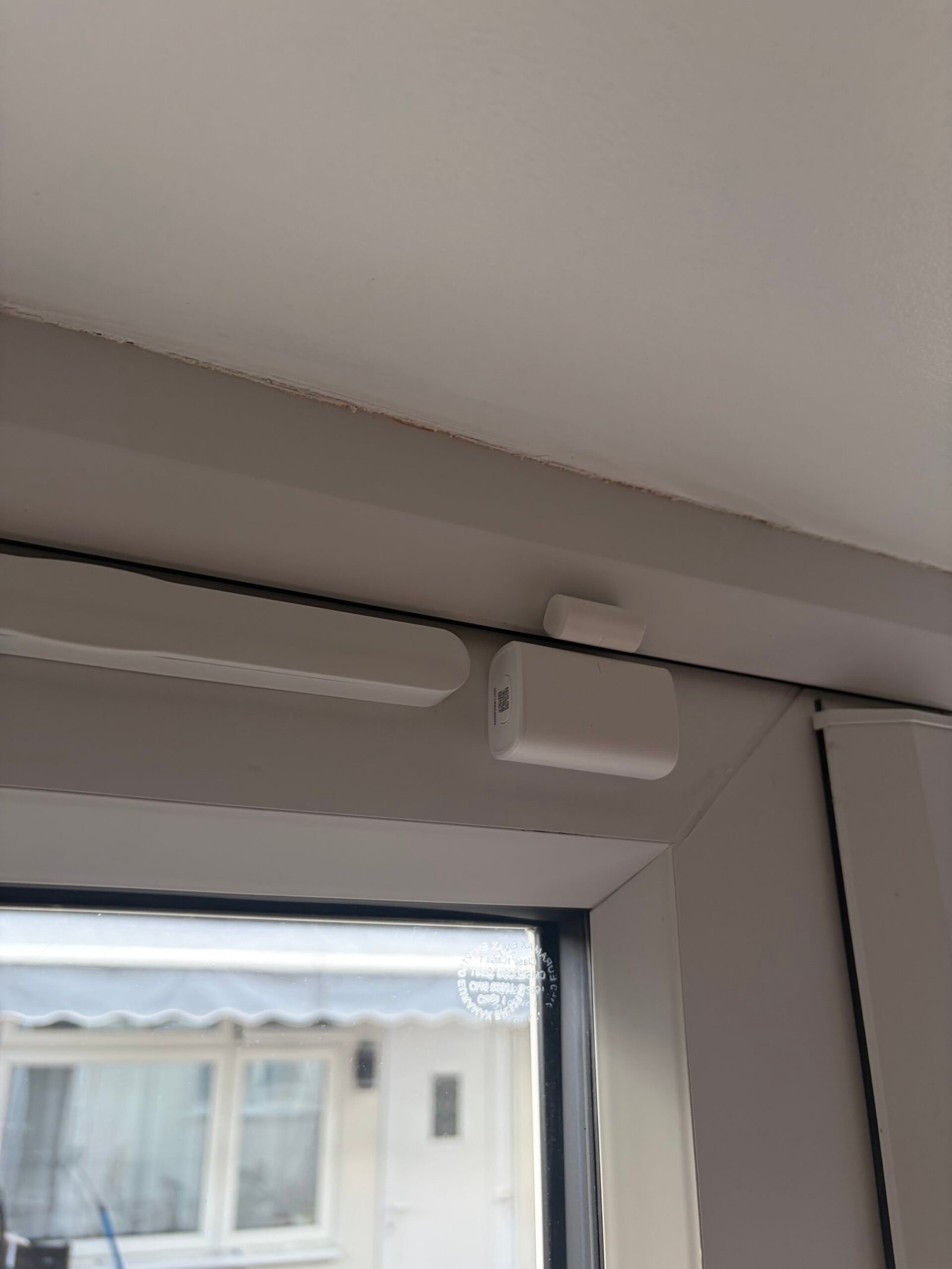 Aqara door sensor on front door — phone alert when opened